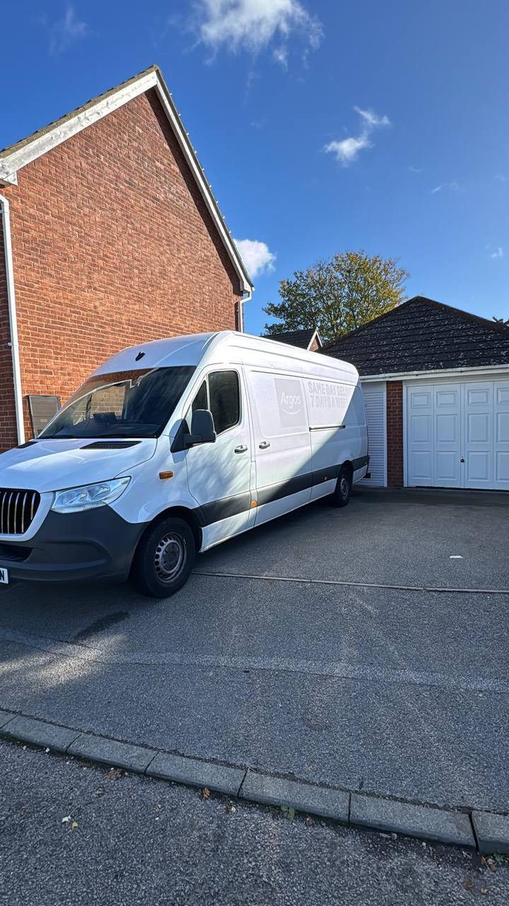 LWB van parked in front of house